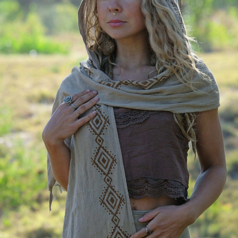 Female model wearing tribal hooded scarf.